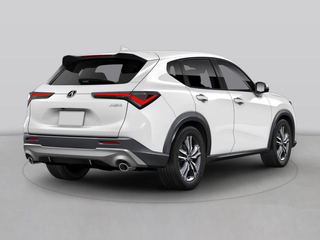 White Acura ADX SUV displayed in a studio setting, shown from a rear three-quarter angle highlighting the taillights and rear design