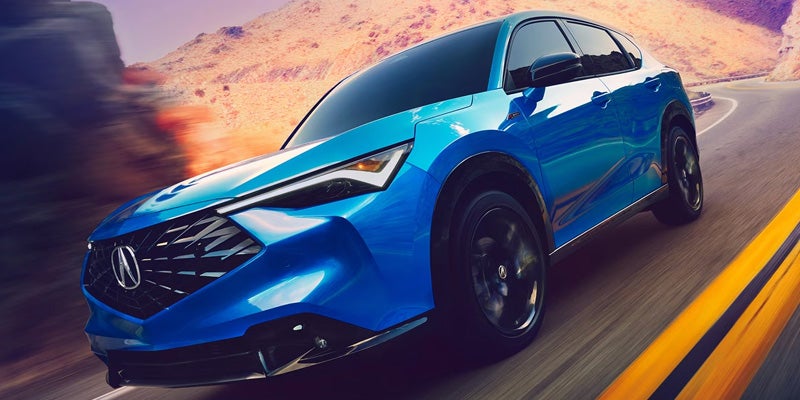 Blue Acura SUV shown in side profile