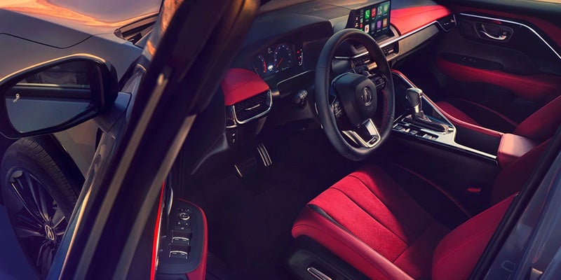 Acura ADX interior with red leather seats and dashboard controls