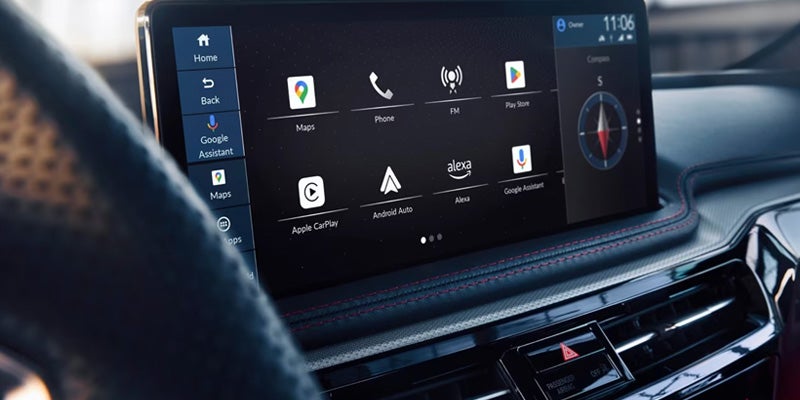 Close-up of an Acura infotainment touchscreen displaying smartphone integration, navigation, phone, media