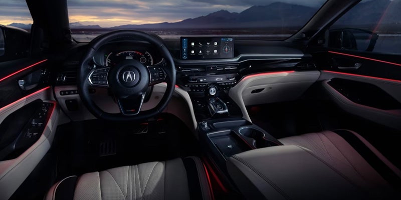 Acura SUV interior with digital displays and ambient lighting
