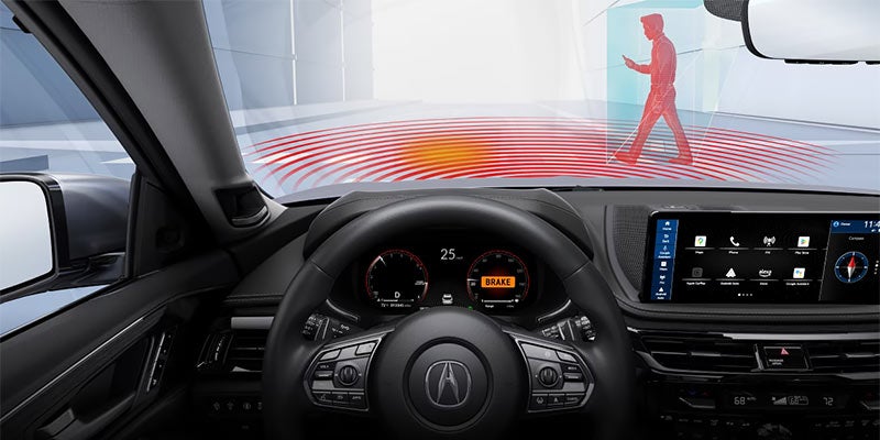 Acura SUV cockpit displaying driver-assistance safety features